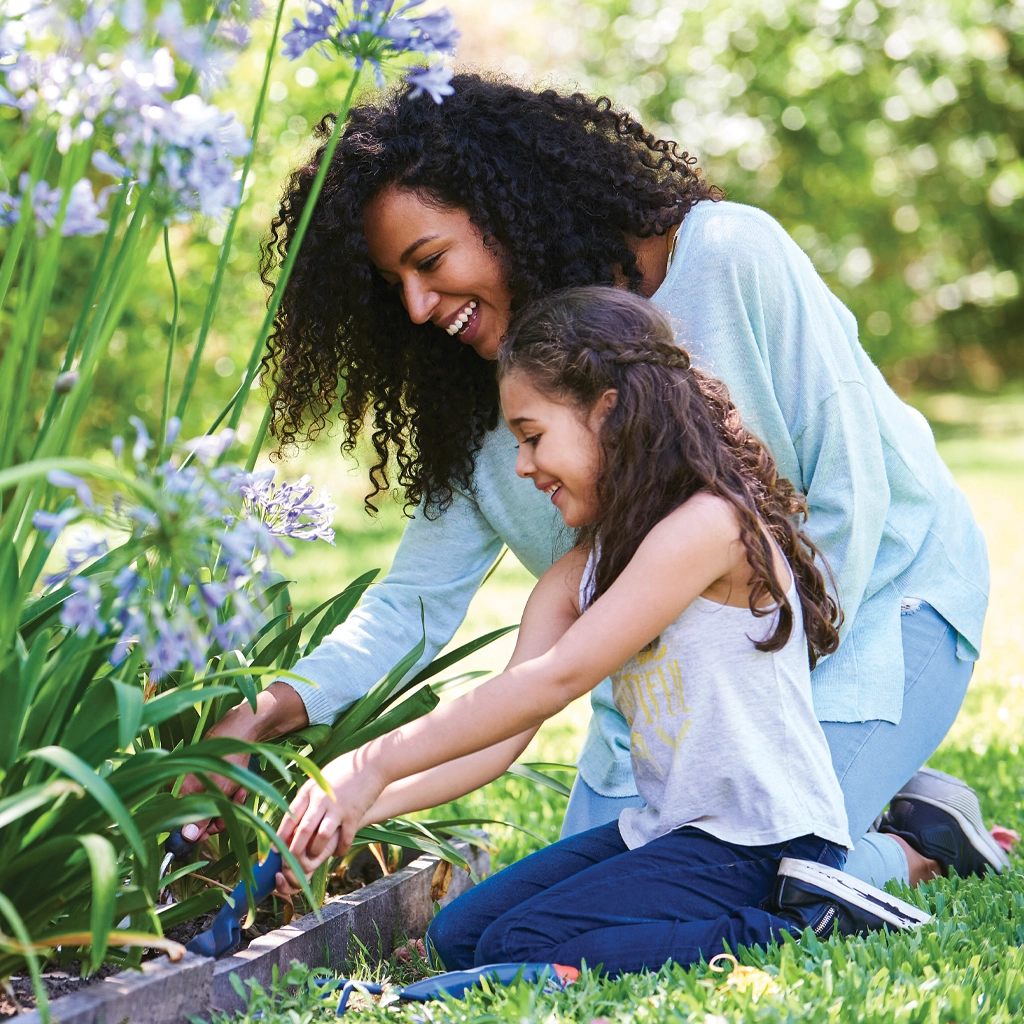 black-woman-and-child-outside-outdoors-gardenibng-1310289685-sq uterine fibroids
