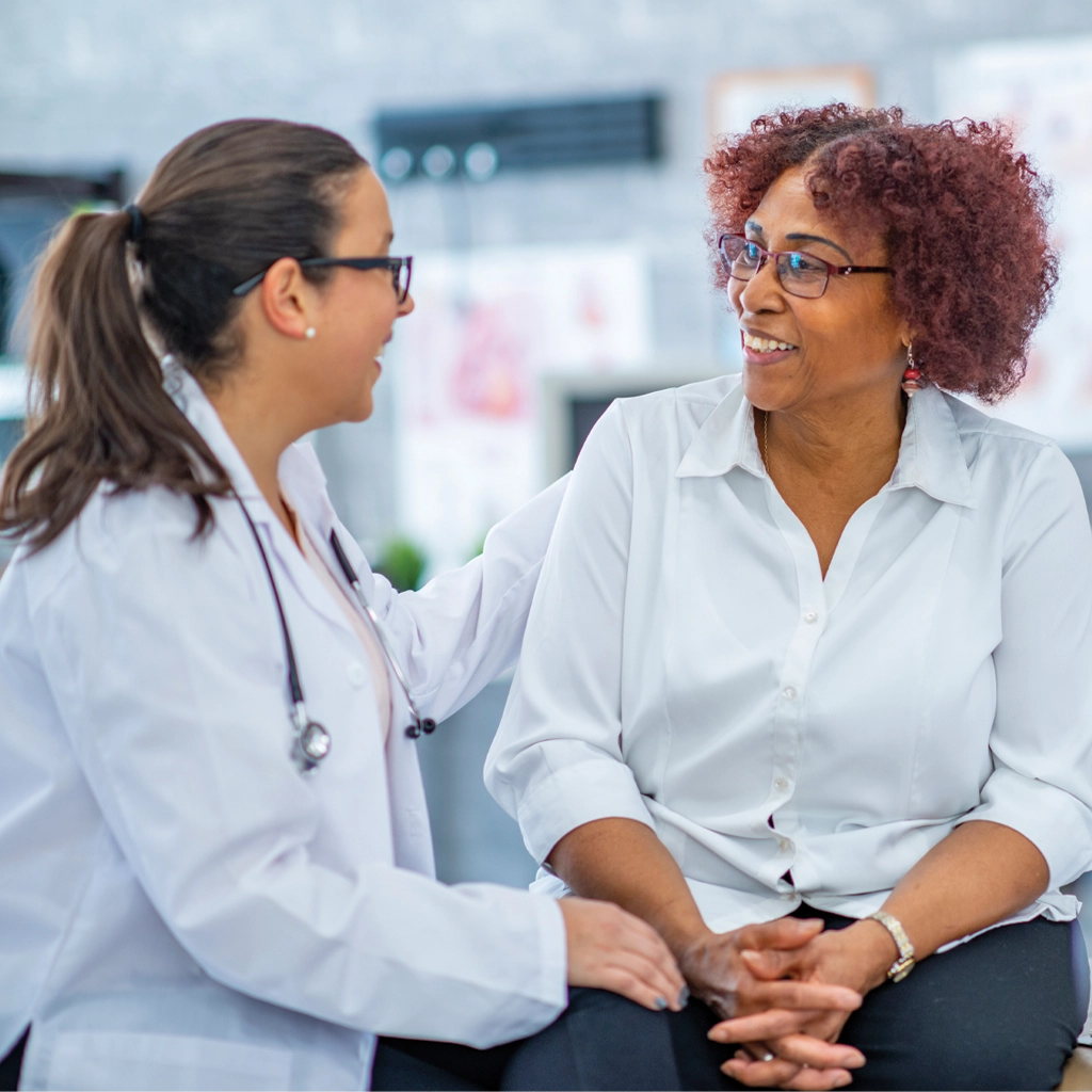 Middle aged black woman with doctor 1134340776